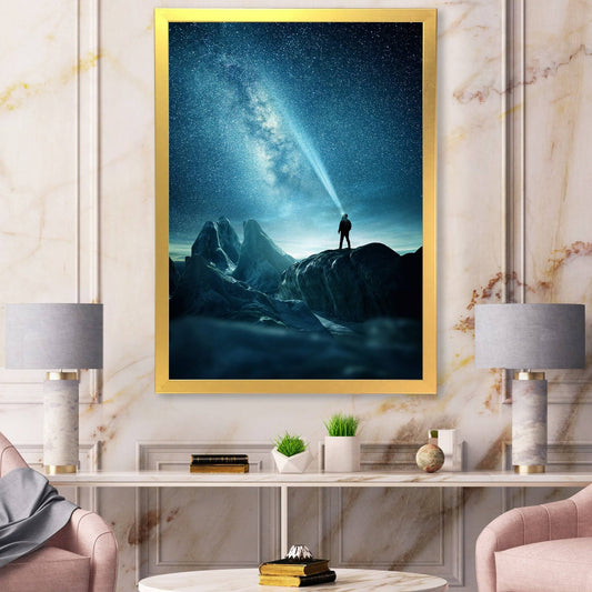 Designart &A Man Shining A Light Into The Night Sky& Modern Framed Art Print - 12 in. Wide x 20 in. High - Gold XDI3_G5AZV29